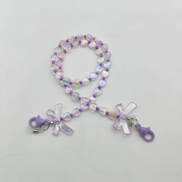 Fashionable glasses holder chain with heart and flower motifs Stornfield