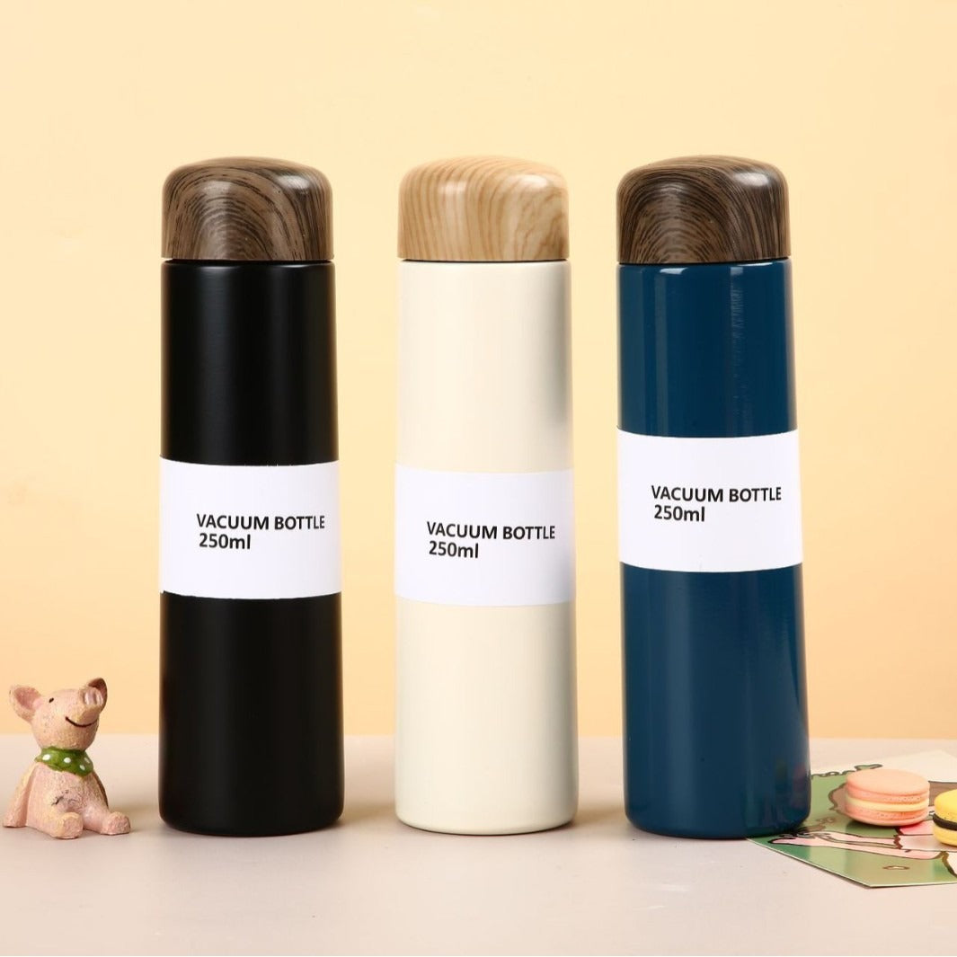Women vacuum-insulated water bottle with innovative wooden lid Stornfield
