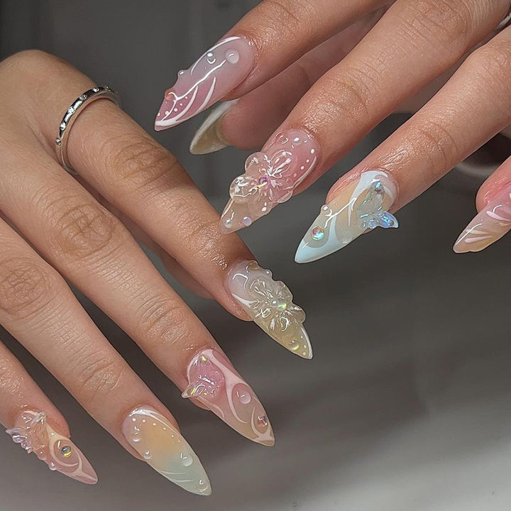 Artful Nail Extensions with 3D Flowers and Glitter Accents Stornfield