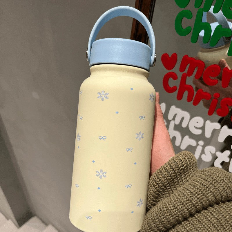 Women's insulated drinking bottle with practical carrying handle and cheerful design Stornfield