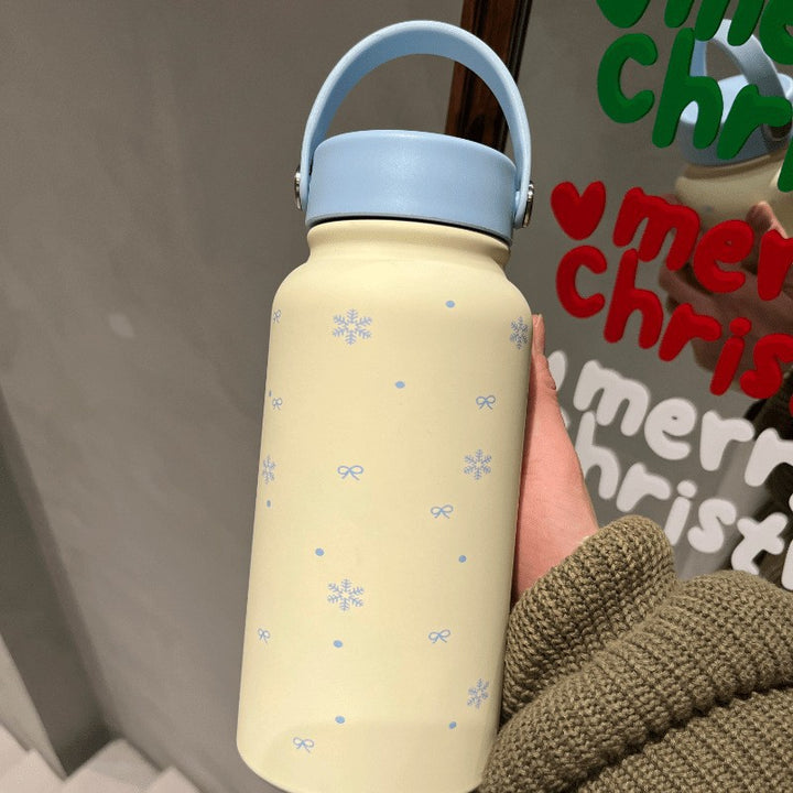 Women's insulated drinking bottle with practical carrying handle and cheerful design Stornfield