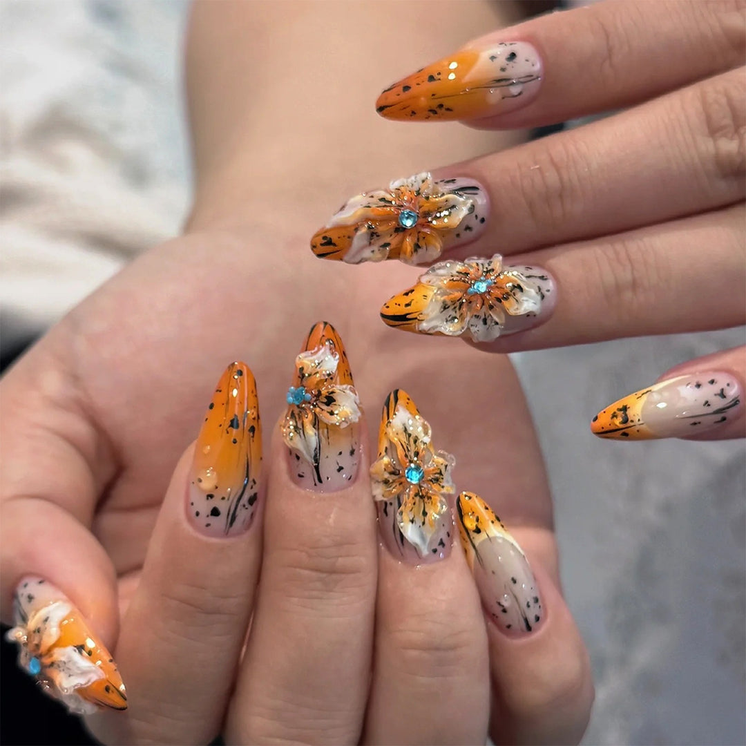 Artificial nail set with elegant floral design and sophisticated glitter elements Stornfield