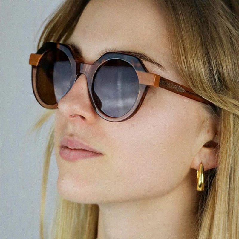 Ladies extravagant round sunglasses with colored accented frame Stornfield