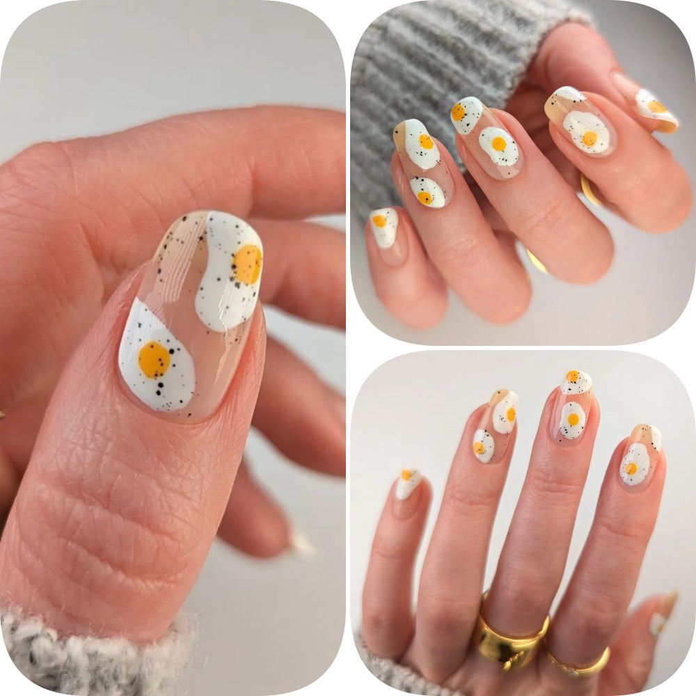 Artificial nails in creative fried egg design Stornfield