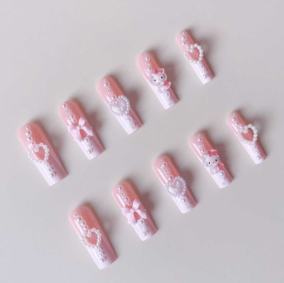 Artificial nail set with playful 3D care and pearl decorations Stornfield