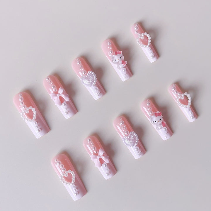 Artificial nail set with playful 3D care and pearl decorations Stornfield