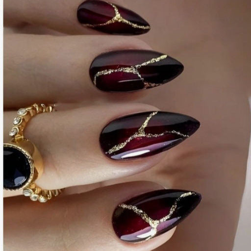 Artistic Press-On Nail Design with Gold Veining Accents Stornfield