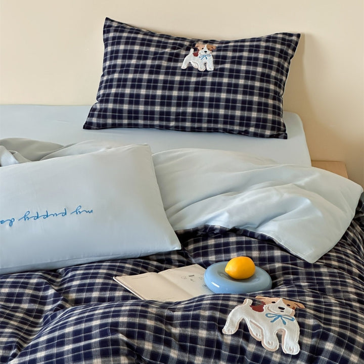 fine striped bed linen set with embroidered cat motif and soft cotton satin