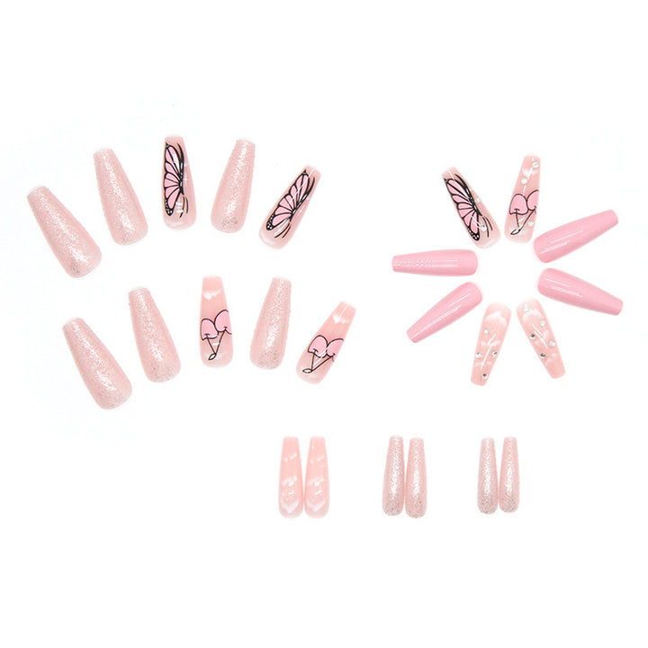 Artificial nail set with romantic butterfly designs and glitter accents Stornfield