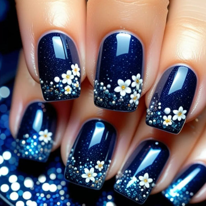 Acrylic nail set with elegant flower design and glitter accents Stornfield