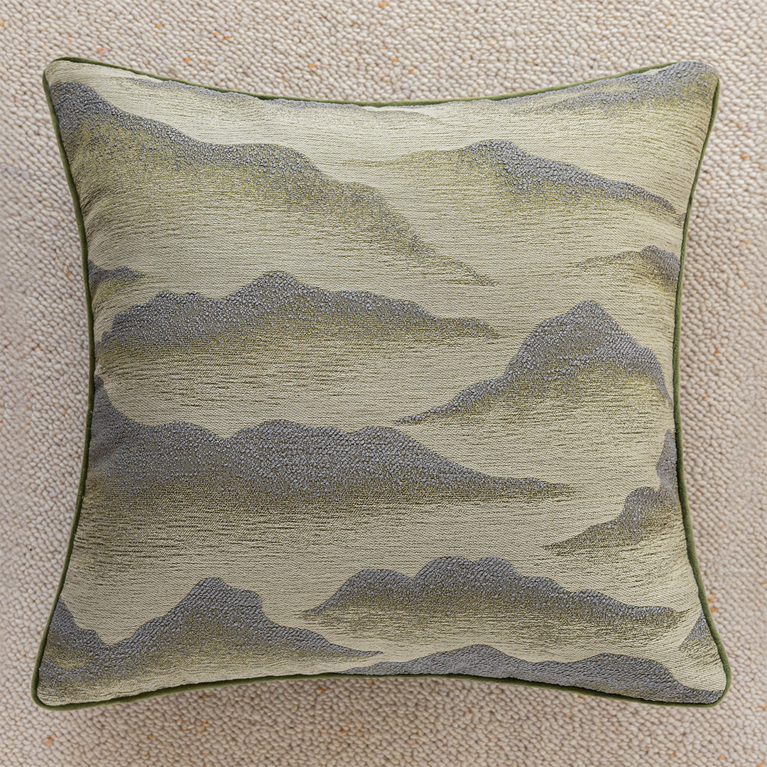 Elegant decorative pillow with elaborate mountain motif