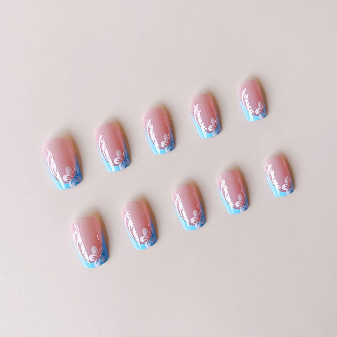 Acrylic nail set with floral designs and elegant tips Stornfield