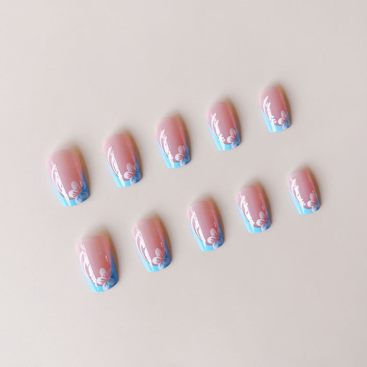Acrylic nail set with floral designs and elegant tips Stornfield