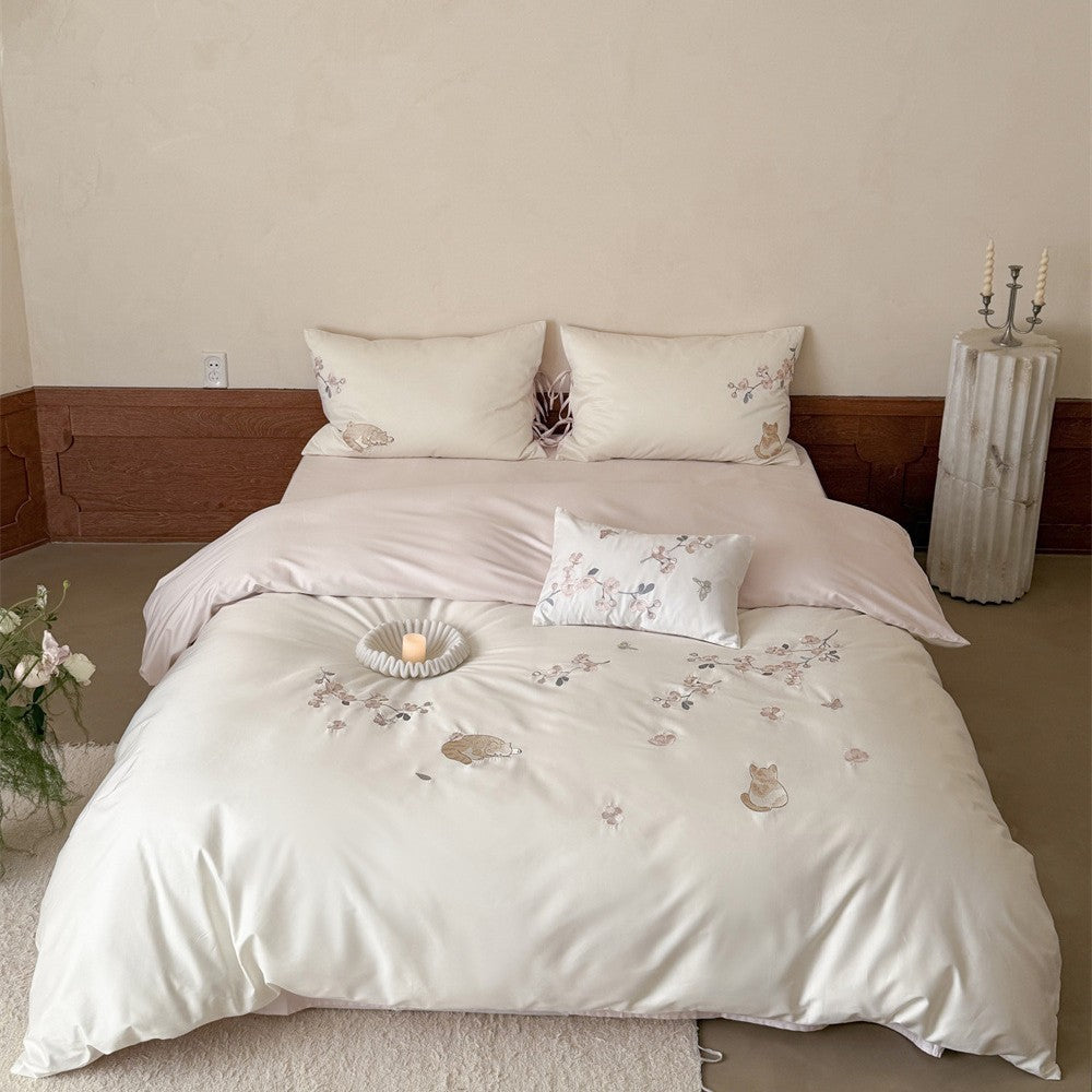 Embroidered satin bedding set with cat and flower motif