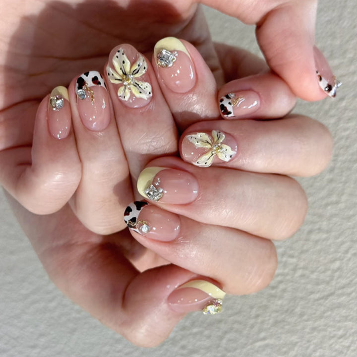 Exclusive nail art with floral design and glitter accents Stornfield