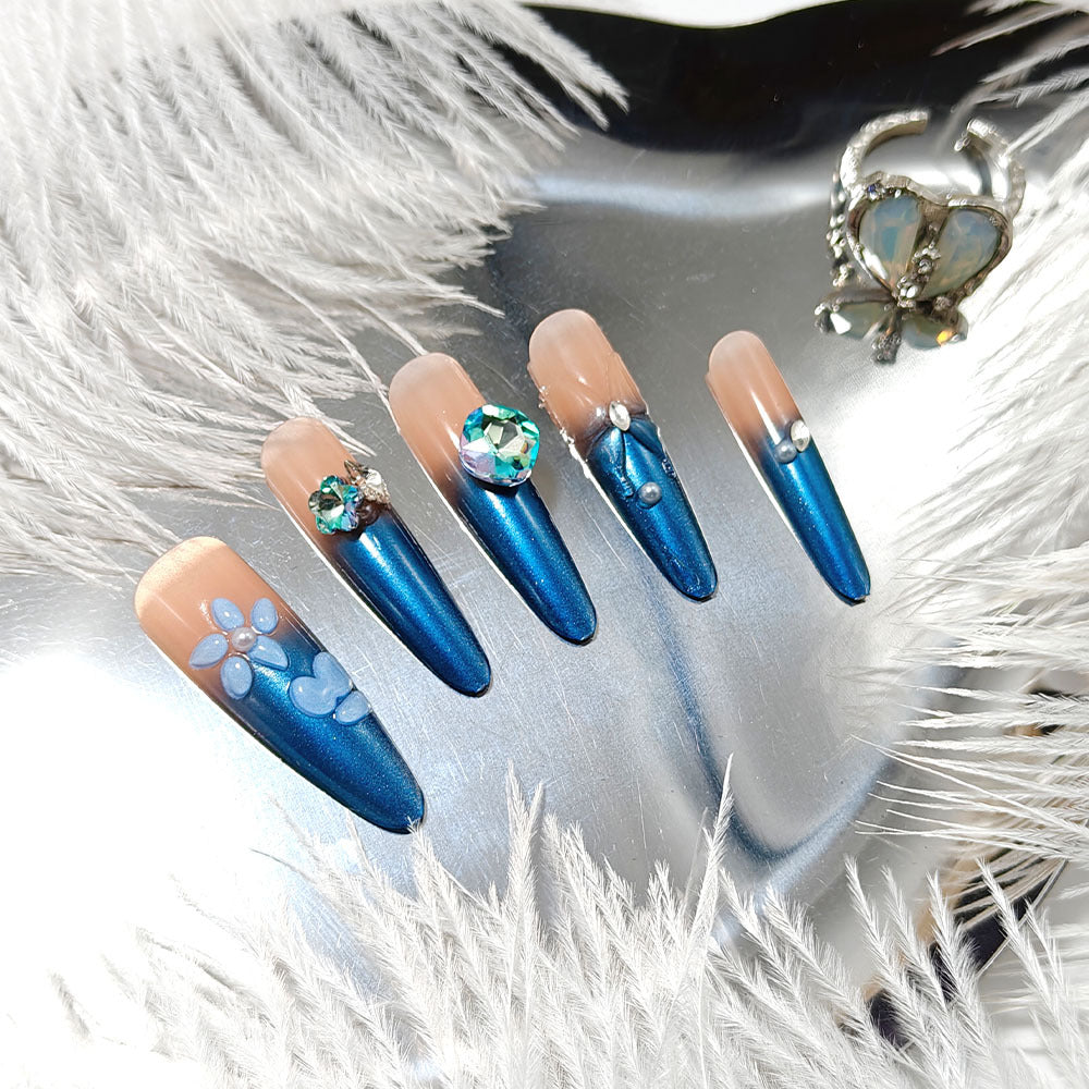 Artificial nails in elegant design with artistic decorations and glitter accents Stornfield
