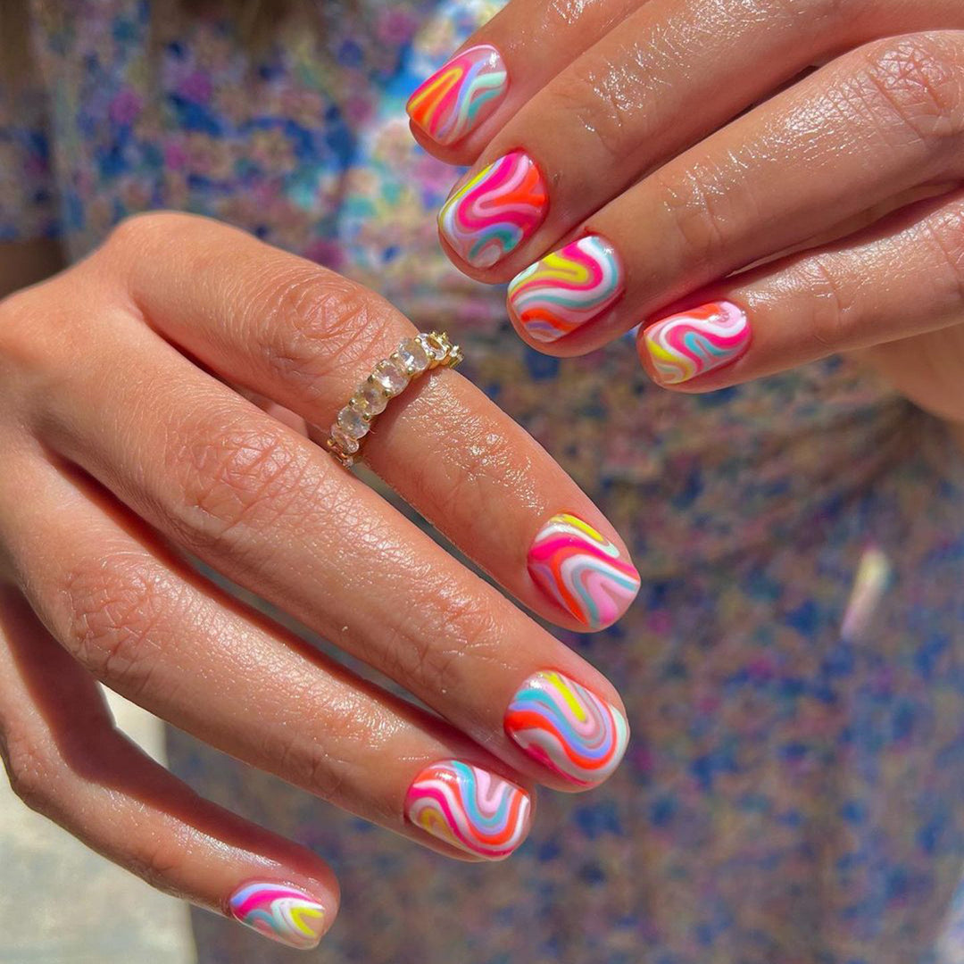 Acrylic nail set with colorful marble design and vibrant colors Stornfield