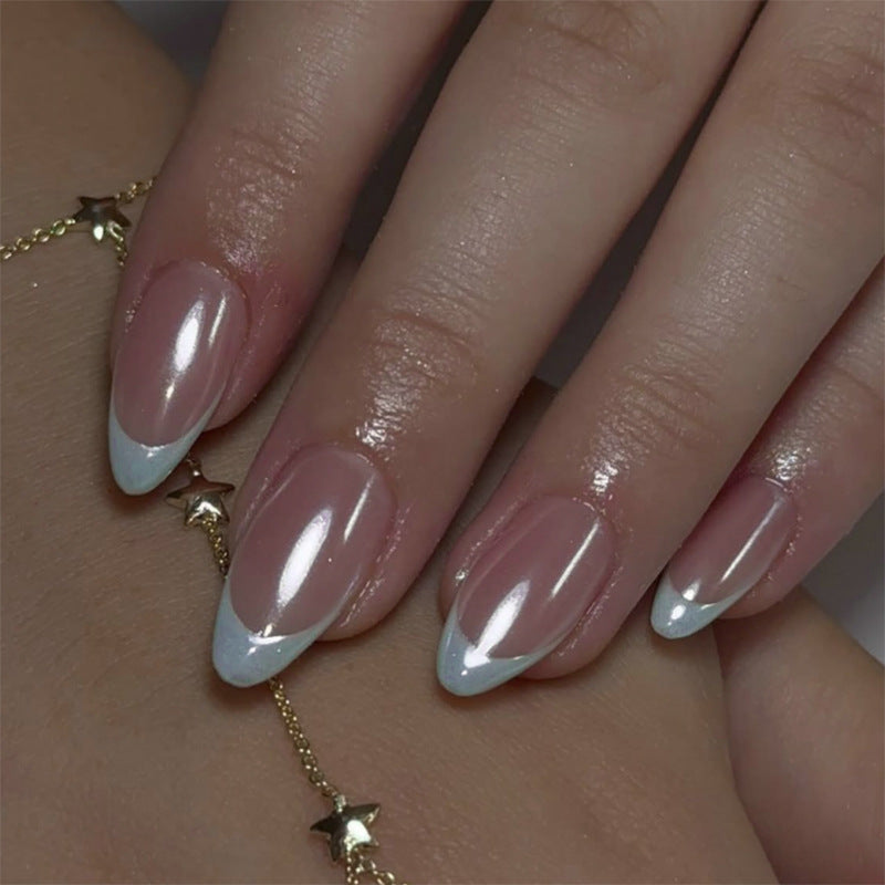Elegant stiletto nails with high-gloss French tip design Stornfield