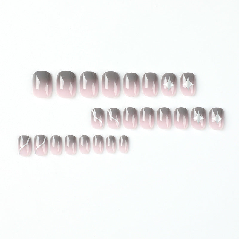 Artificial nail art with elegant ombre design and charming accents Stornfield