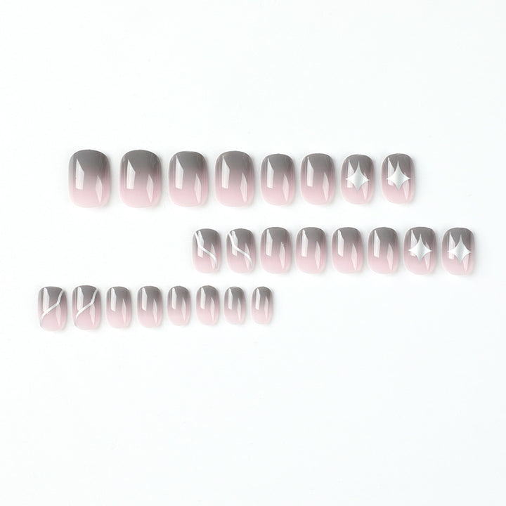 Artificial nail art with elegant ombre design and charming accents Stornfield