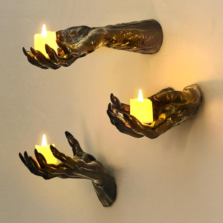 Wall candle holder in realistically shaped hand made of resin