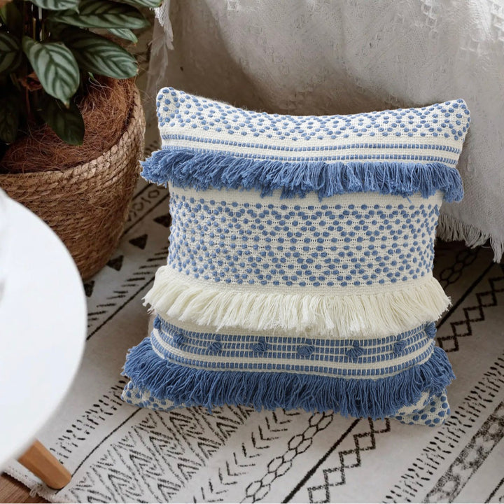 Textured Boho decorative pillow with fringes, tassels, and woven dot pattern
