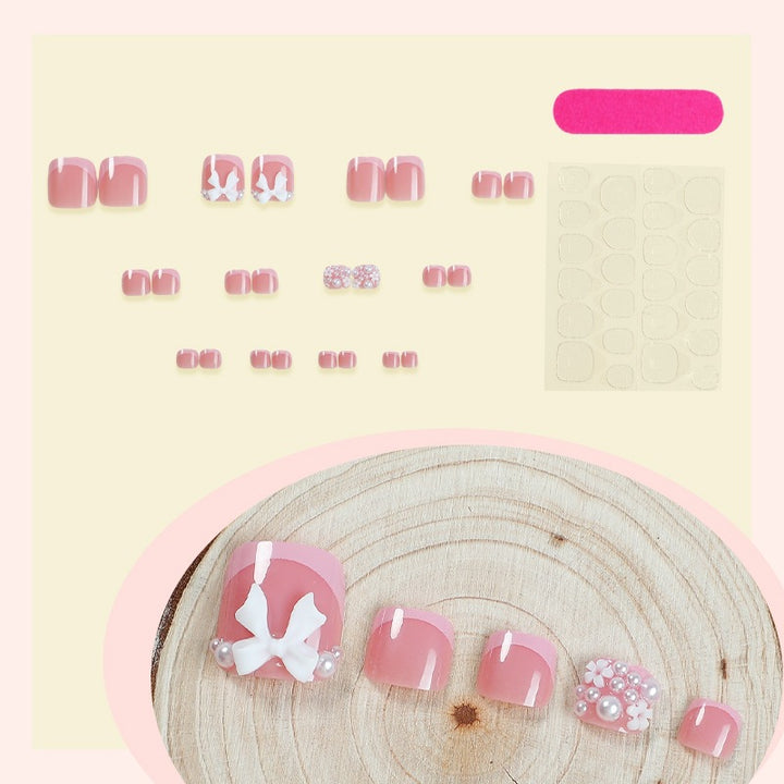 Artificial nail set with romantic bow design Stornfield