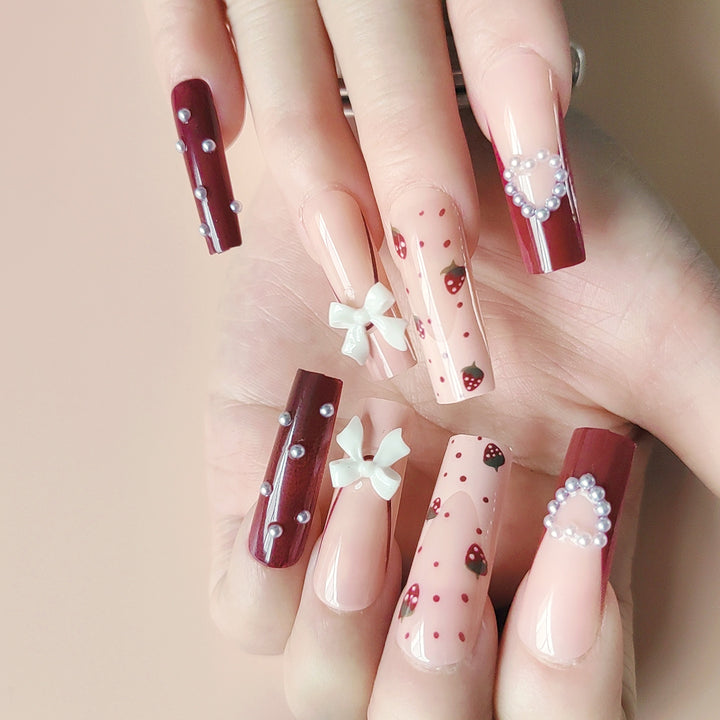 Artificial artificial nails with heart designs and holographic accents Stornfield