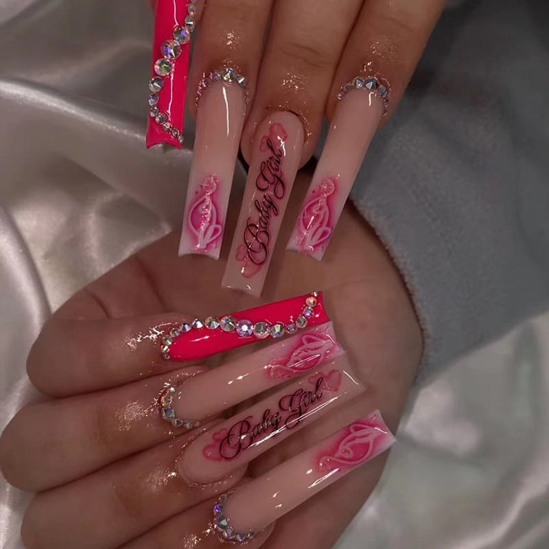 Artificial nail art with luxurious rhinestone and flower decorations Stornfield