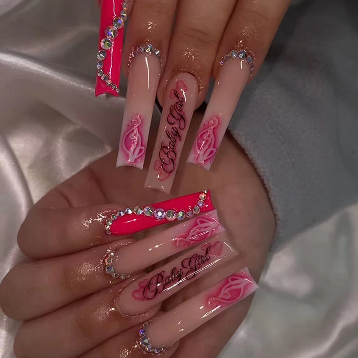 Artificial nail art with luxurious rhinestone and flower decorations Stornfield