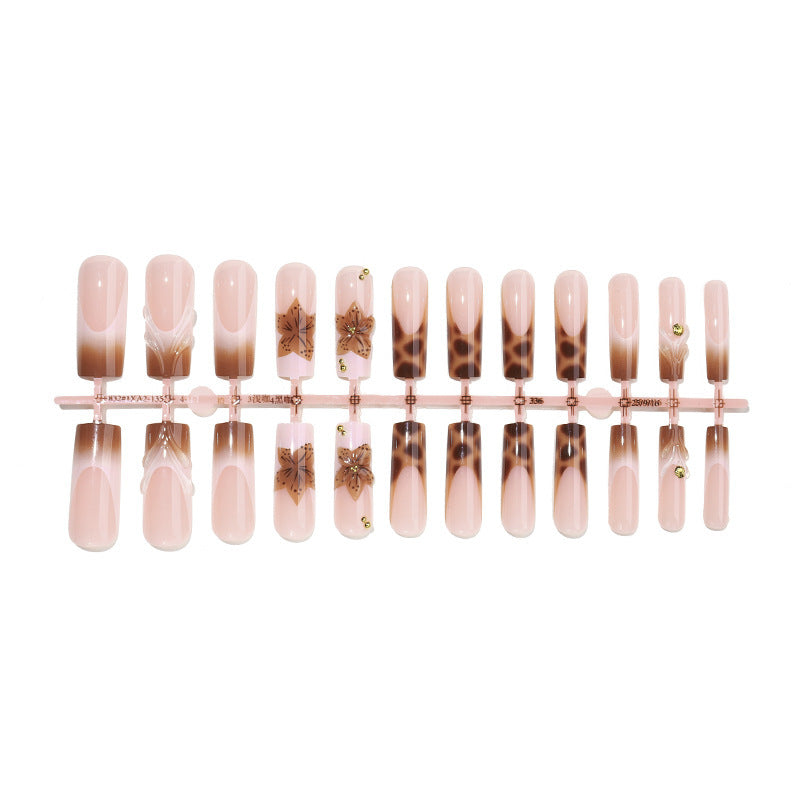 Creative nail art set with floral accents and ombre effect Stornfield