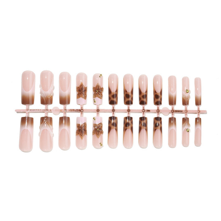 Creative nail art set with floral accents and ombre effect Stornfield