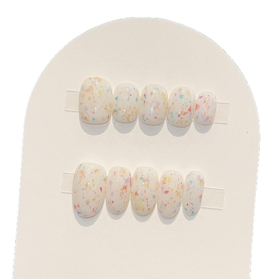 Artificial nails with cheerful sparkle design Stornfield