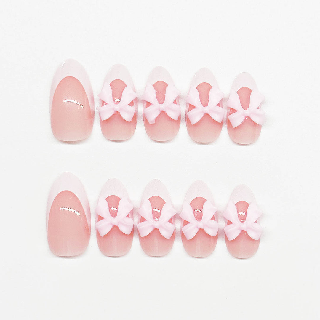 Nail art set with playful bow accents Stornfield