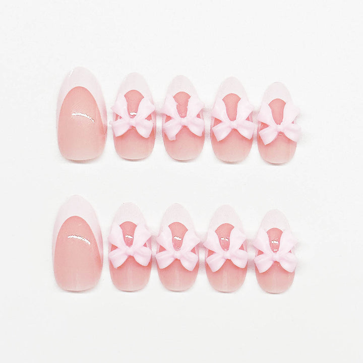 Nail art set with playful bow accents Stornfield
