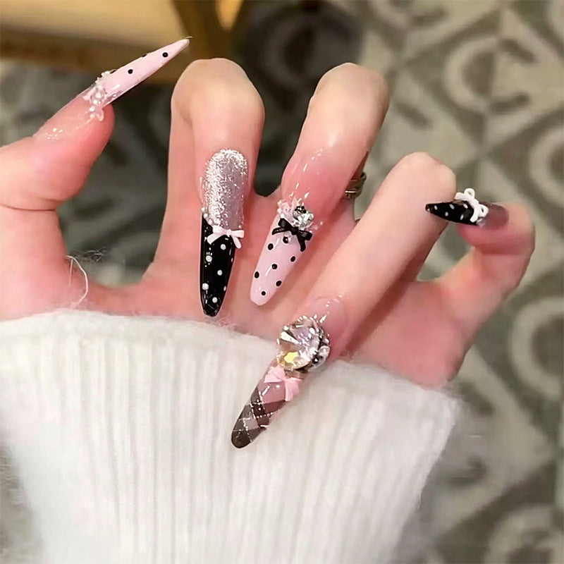 Artificial nail set with glamorous 3D applications and festive design Stornfield