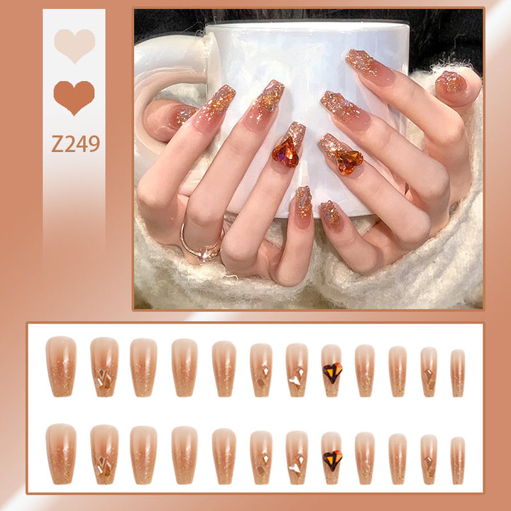 Artificial nail set with glitter and heart accents Stornfield