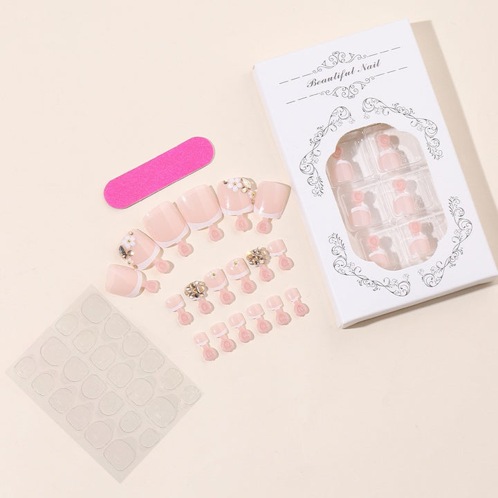 Acrylic nail set with elegant glitter and flower details Stornfield
