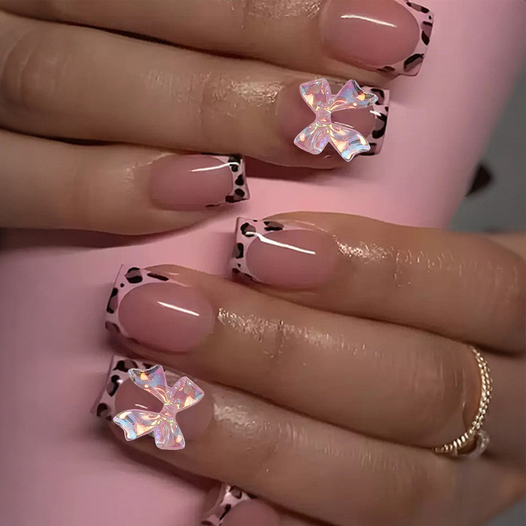 Artificial nail set with glamorous leopard pattern and elegant bows Stornfield