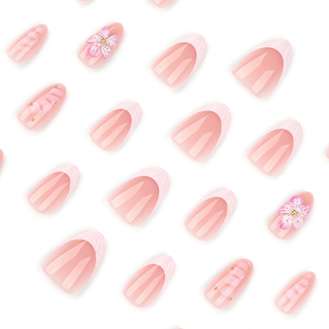 Artful Nail Extensions with Floral Design and Glitter Accents Stornfield