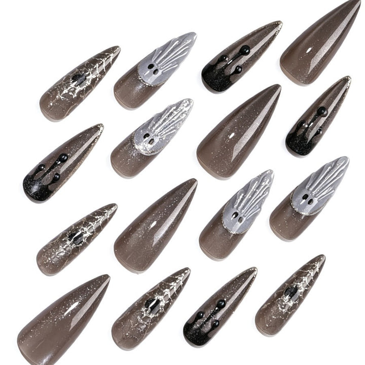 Artificial nail set with glamorous metallic elements and delicate details Stornfield