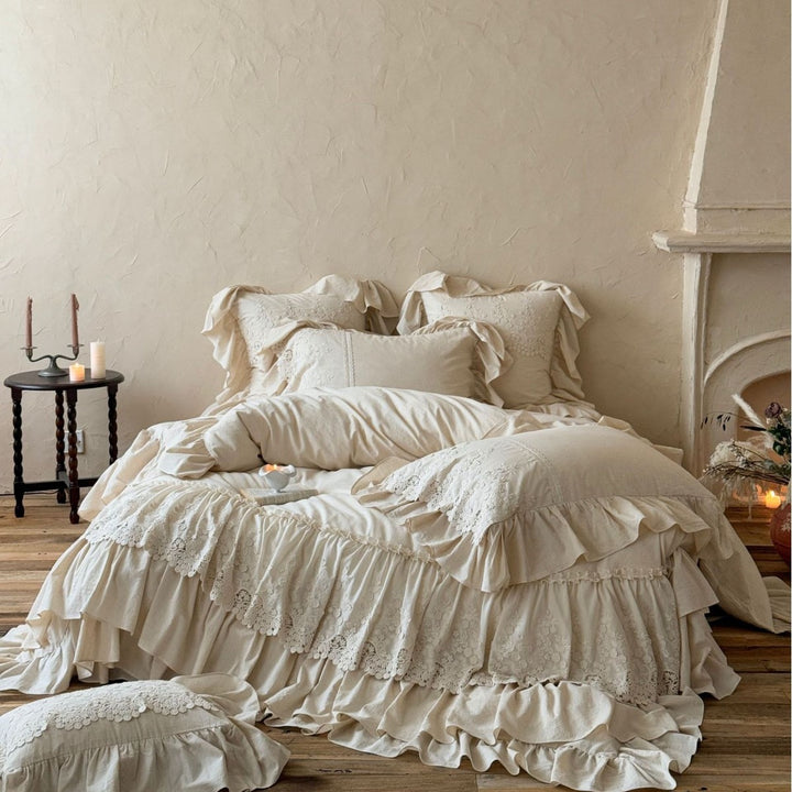 Vintage-inspired duvet cover set with layered ruffles and lace appliqué
