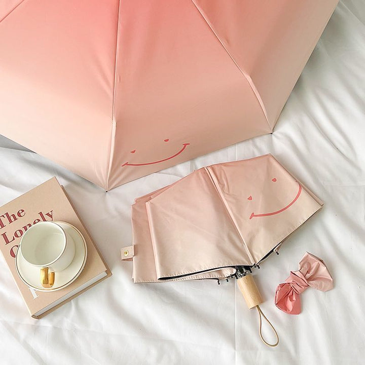 Women's foldable umbrella with playful design and handy wooden handle Stornfield