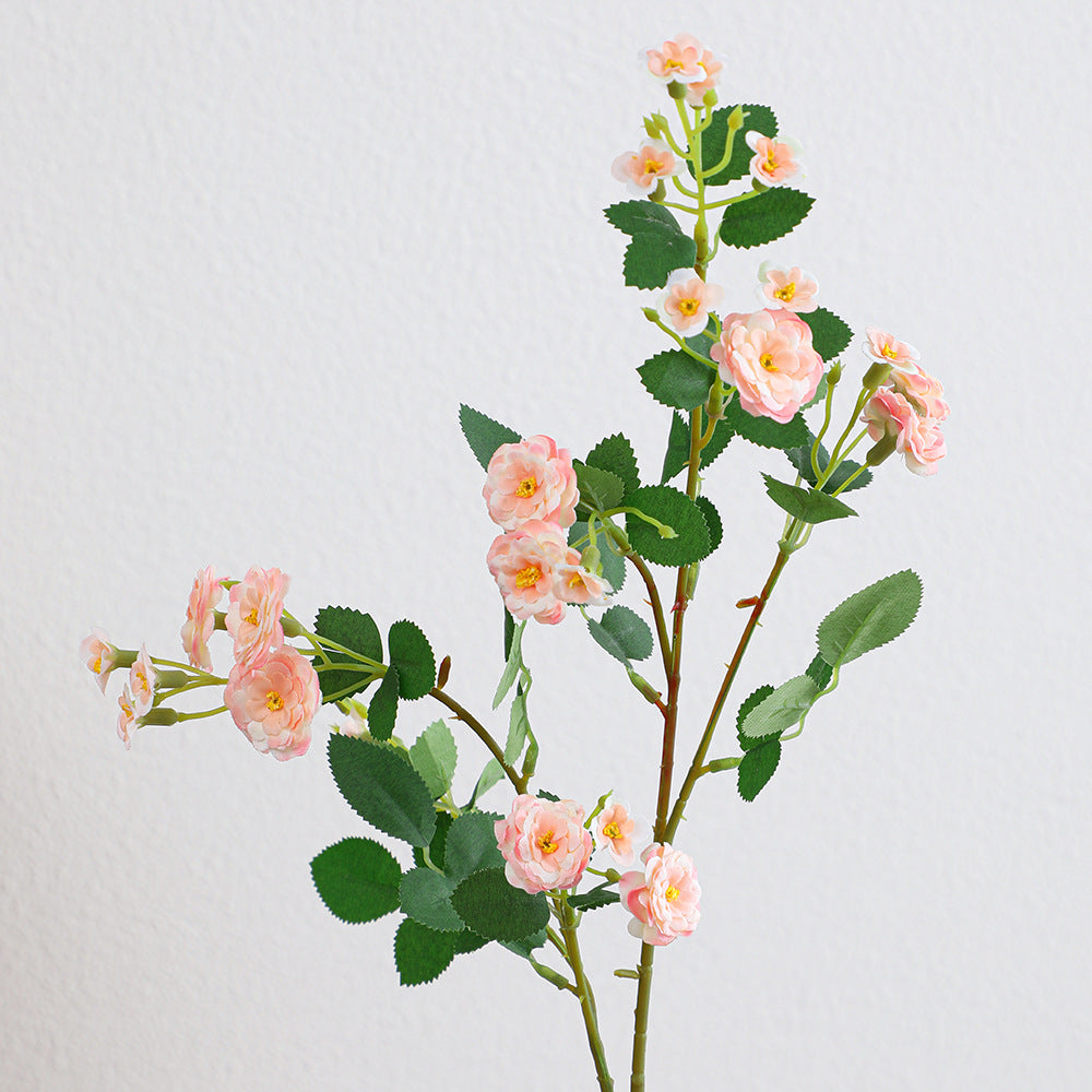 Artificial branch with decorative flowers