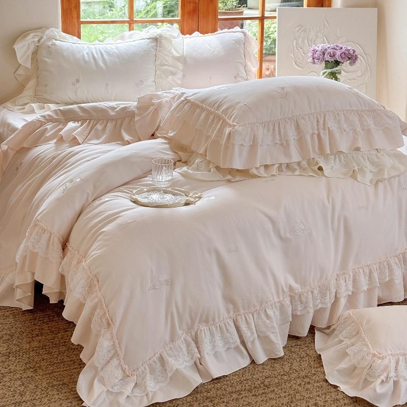 Romantic cotton bedding set with ruffles and delicate floral embroidery