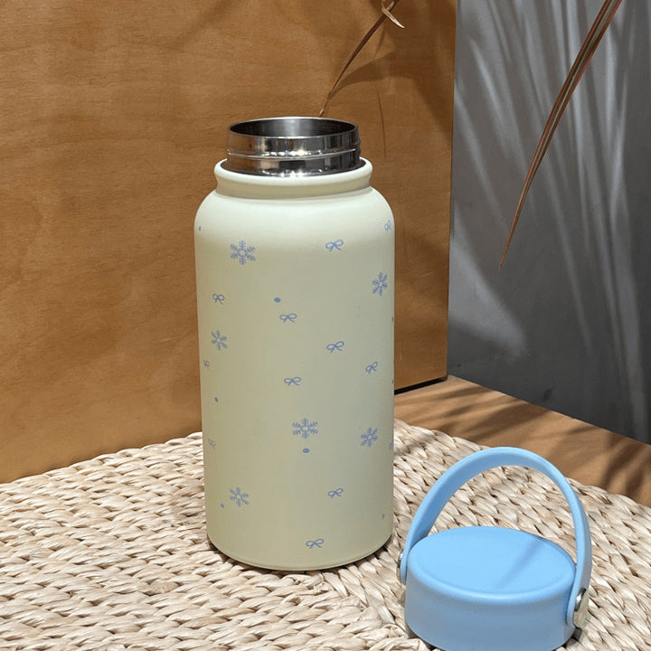 Women's insulated drinking bottle with practical carrying handle and cheerful design Stornfield