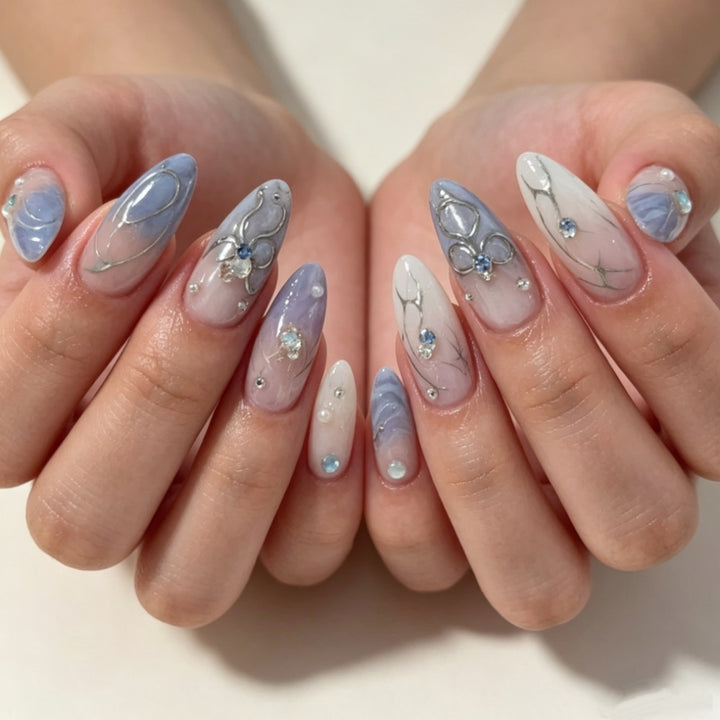 Artistic Press-On Nail Design with Floral and Gem Accents Stornfield