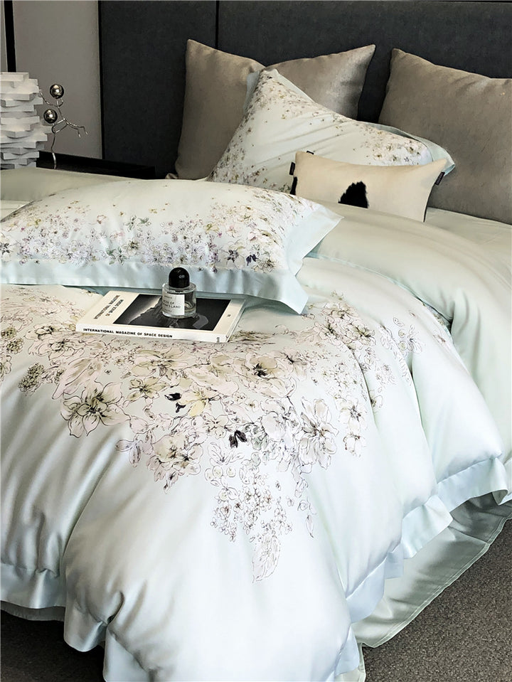 Duvet cover set made of cotton satin with subtle watercolor flower print and silky-matte texture