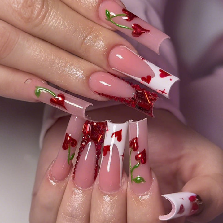 Creative nail art set with romantic heart designs and glitter accents Stornfield