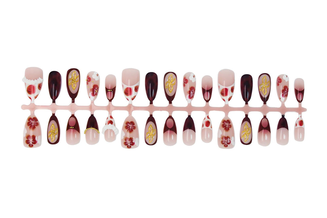 Artificial nail set with luxurious floral designs and glitter accents Stornfield